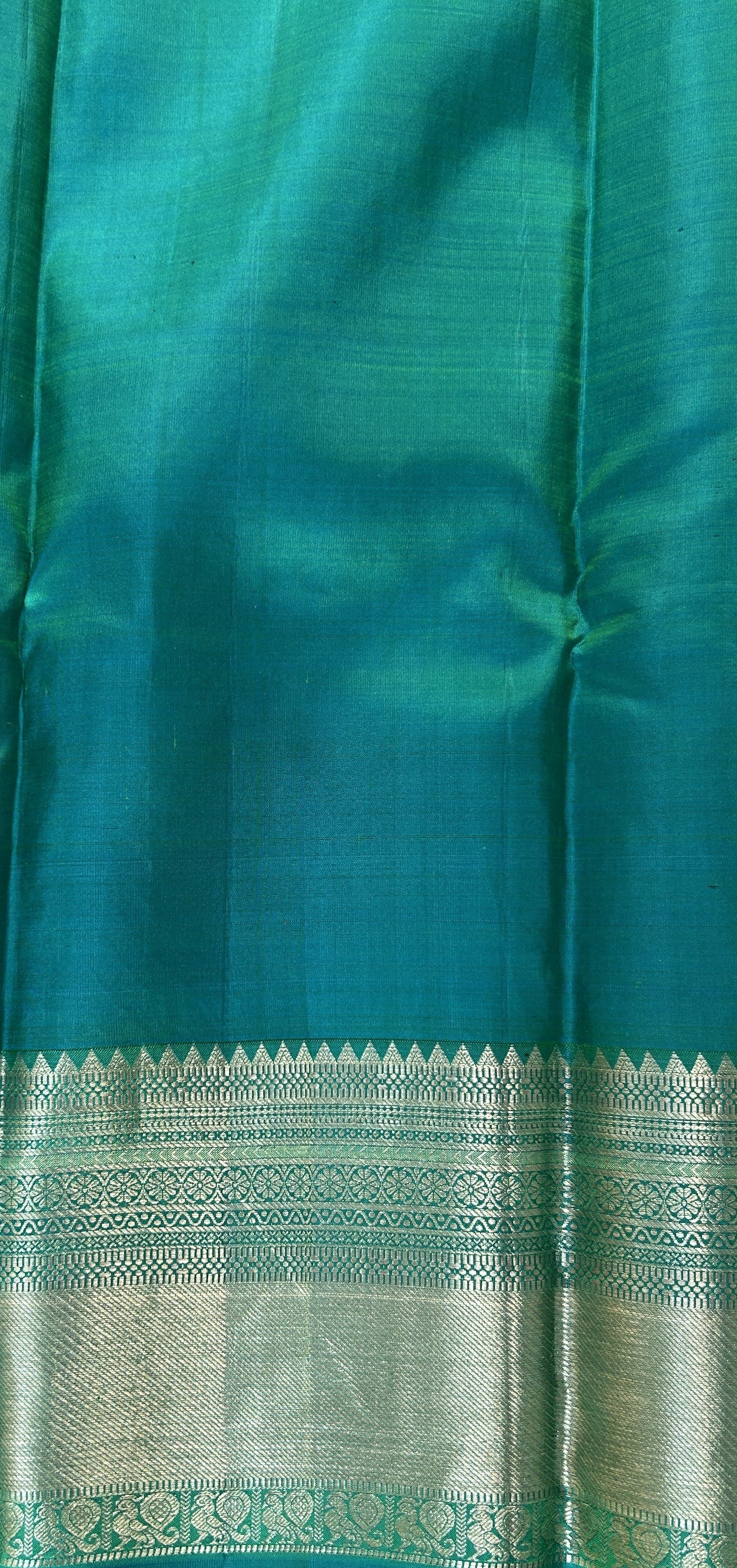 Kanjivaram Festive Silk Saree Green colored Saree complemented with a Blue Kanchi border. - Sampradaya Designer Studio