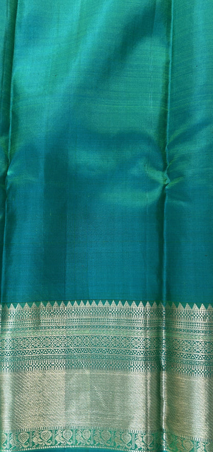 Kanjivaram Festive Silk Saree Green colored Saree complemented with a Blue Kanchi border. - Sampradaya Designer Studio