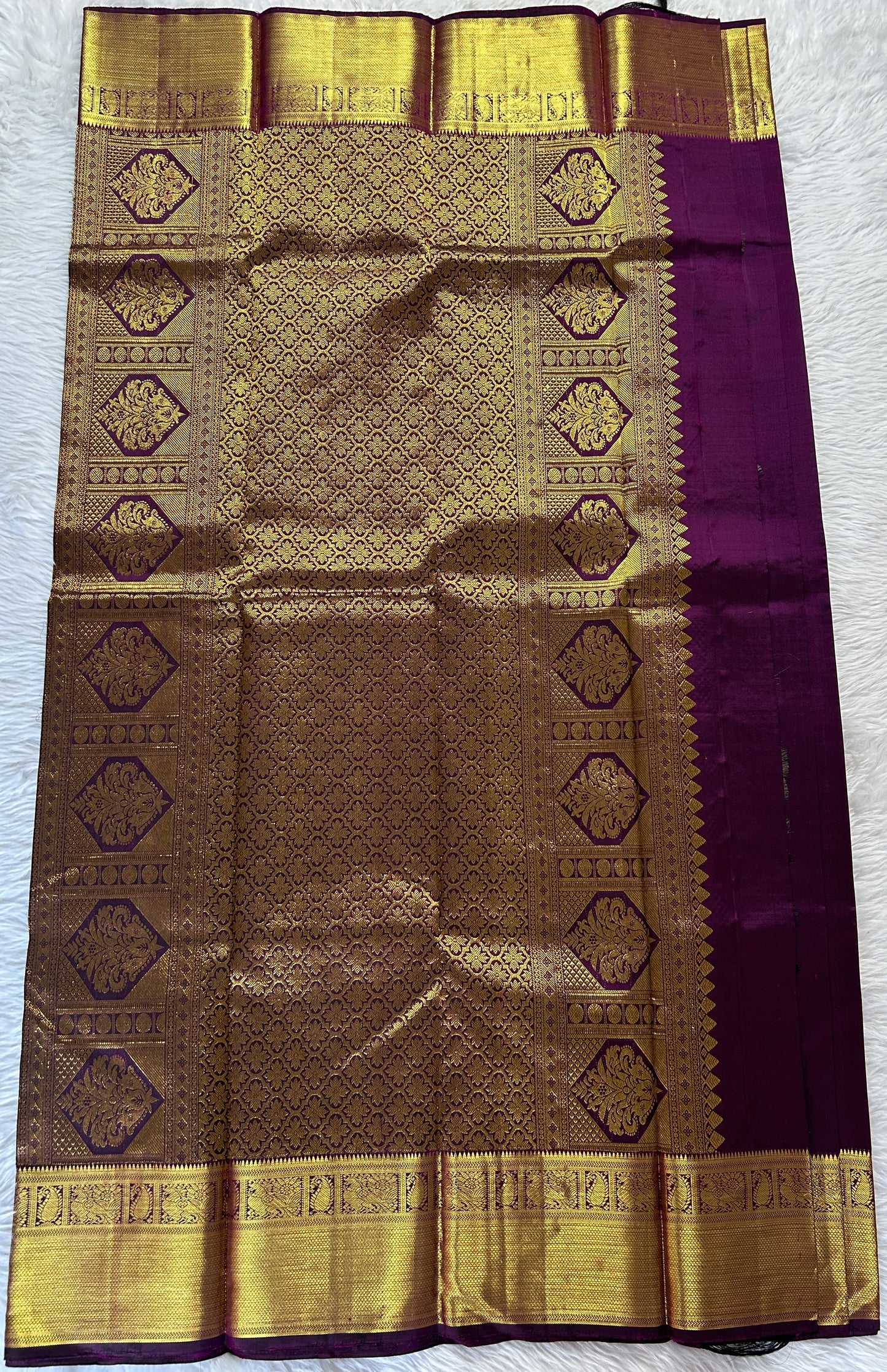 Kanjivaram Festive Silk Saree Dark Purple colored Saree complemented with a Kanchi border. - Sampradaya Designer Studio