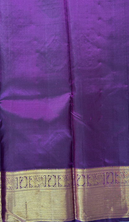 Kanjivaram Festive Silk Saree Dark Purple colored Saree complemented with a Kanchi border. - Sampradaya Designer Studio