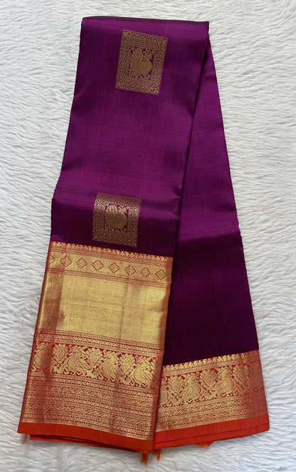 Kanjivaram Festive Silk Saree Dark Purple colored Saree complemented with a Orange Colored Kanchi border. - Sampradaya Designer Studio