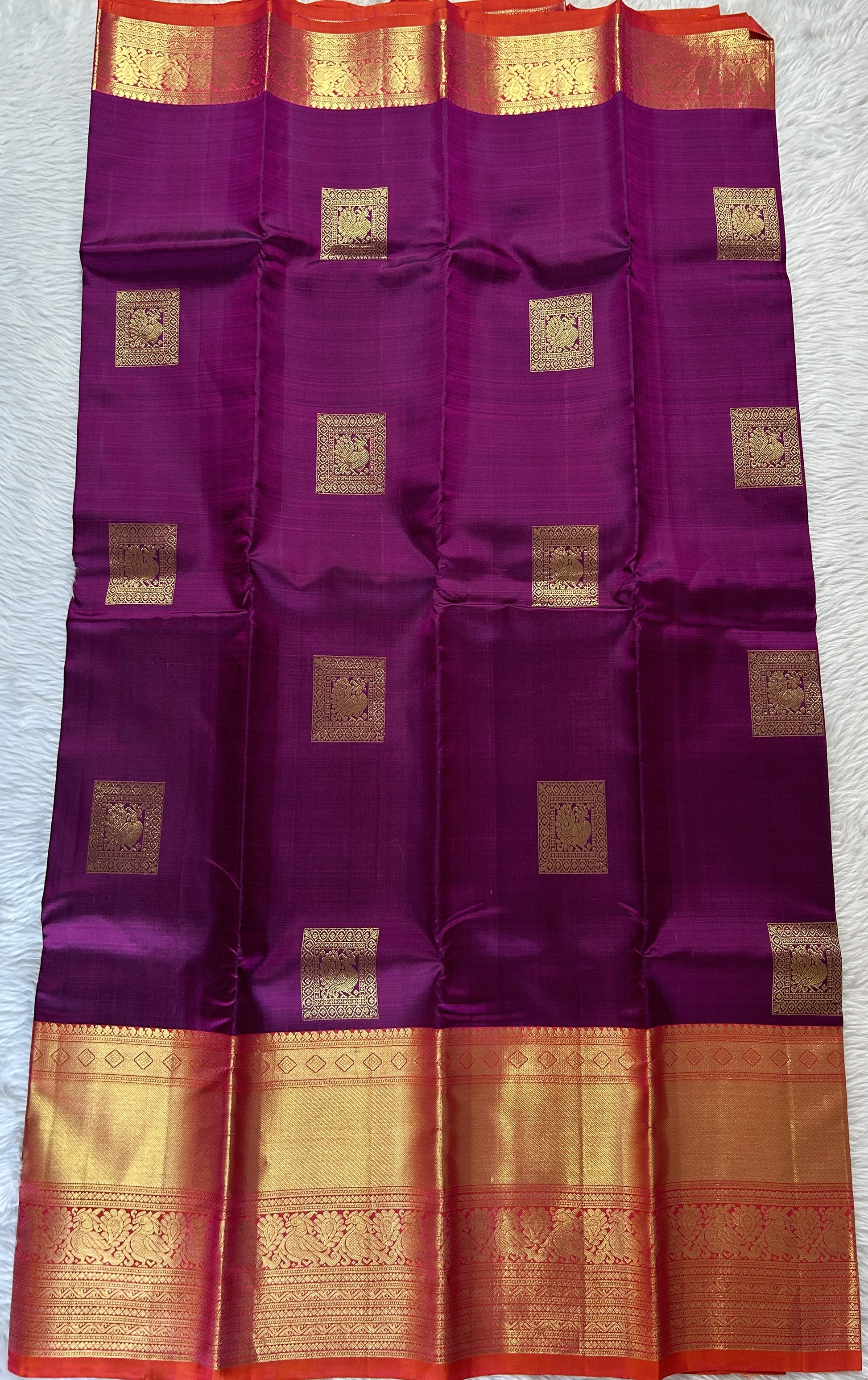 Kanjivaram Festive Silk Saree Dark Purple colored Saree complemented with a Orange Colored Kanchi border. - Sampradaya Designer Studio