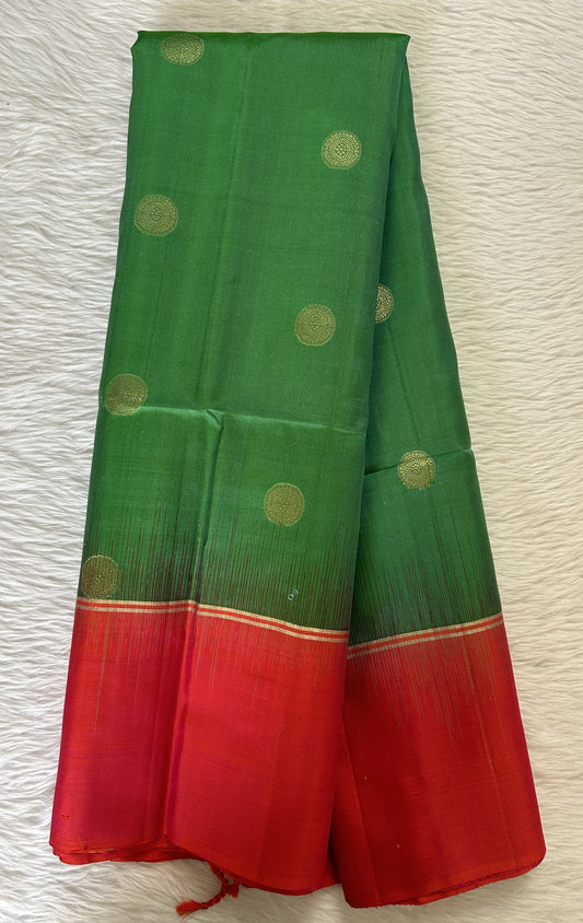 Kanjivaram Festive Silk Saree Green colored Saree complemented with a Pinkish Orange Colored Plain border. - Sampradaya Designer Studio