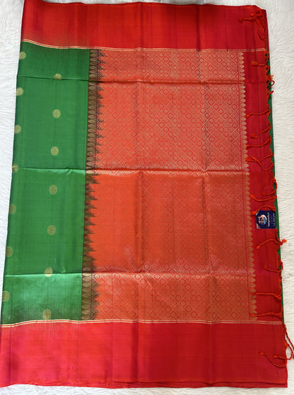 Kanjivaram Festive Silk Saree Green colored Saree complemented with a Pinkish Orange Colored Plain border. - Sampradaya Designer Studio