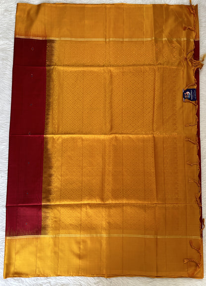 Kanjivaram Festive Silk Saree Maroon colored Saree complemented with a Yellow Colored Plain border. - Sampradaya Designer Studio