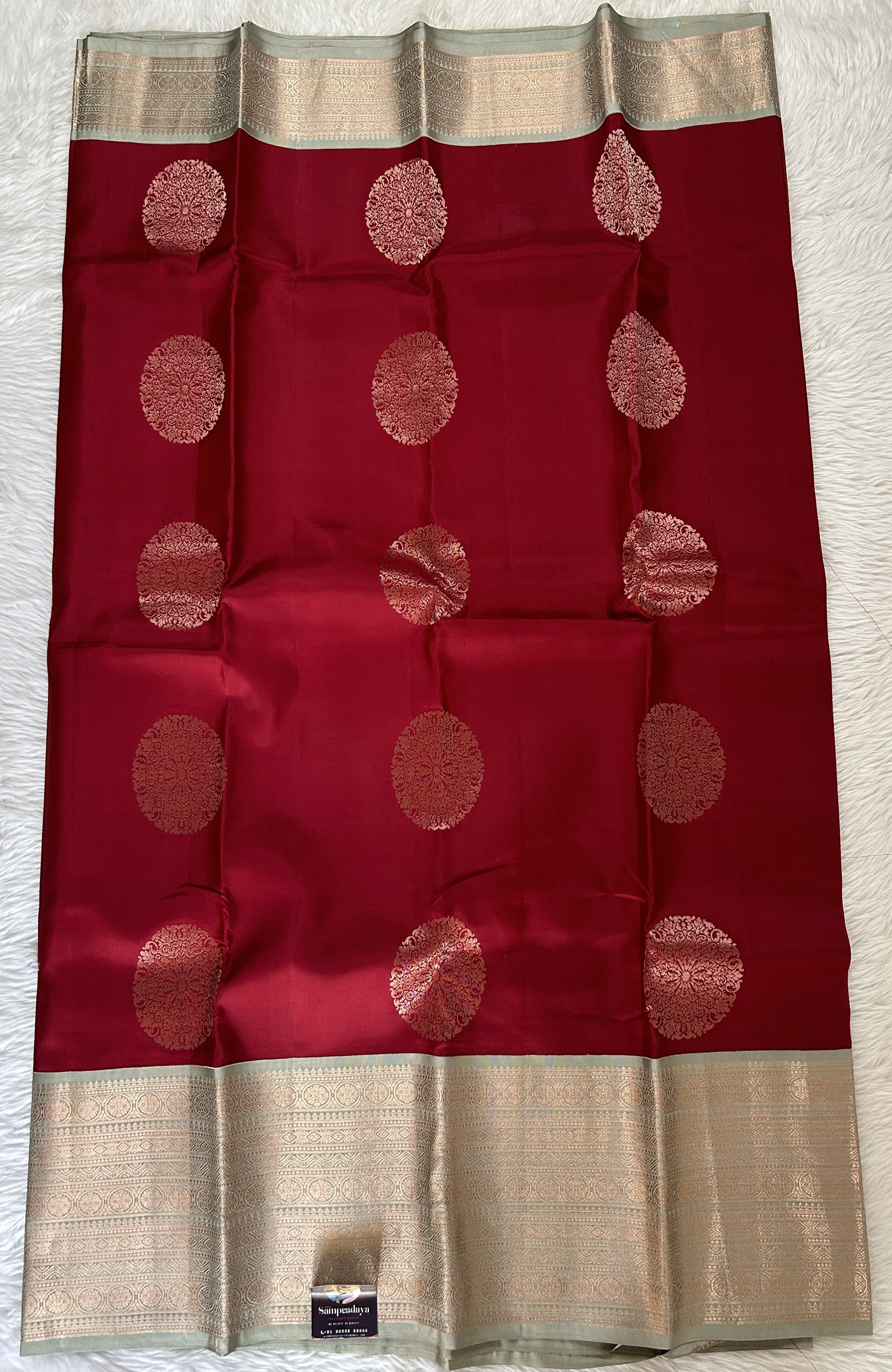 Kanjivaram Festive Silk Saree Maroon colored Saree complemented with a Pastel Green Colored Kanchi border. - Sampradaya Designer Studio