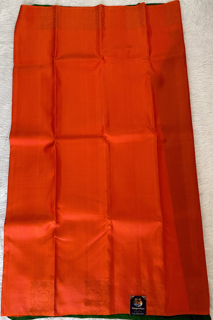 Kanjivaram Festive Silk Saree Orange colored Saree complemented with a Borderless Saree. - Sampradaya Designer Studio