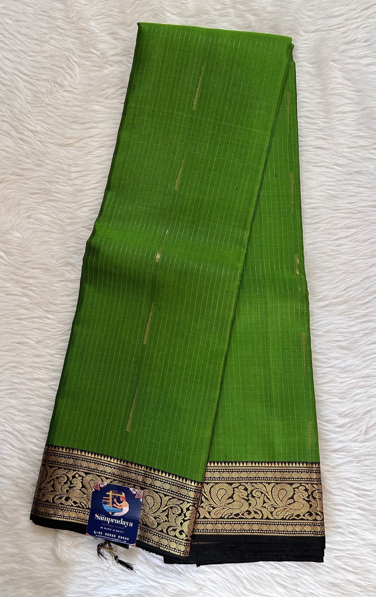 Kanjivaram Festive Silk Saree Parrot Green colored Saree complemented with a Black Color Kanchi Border. - Sampradaya Designer Studio