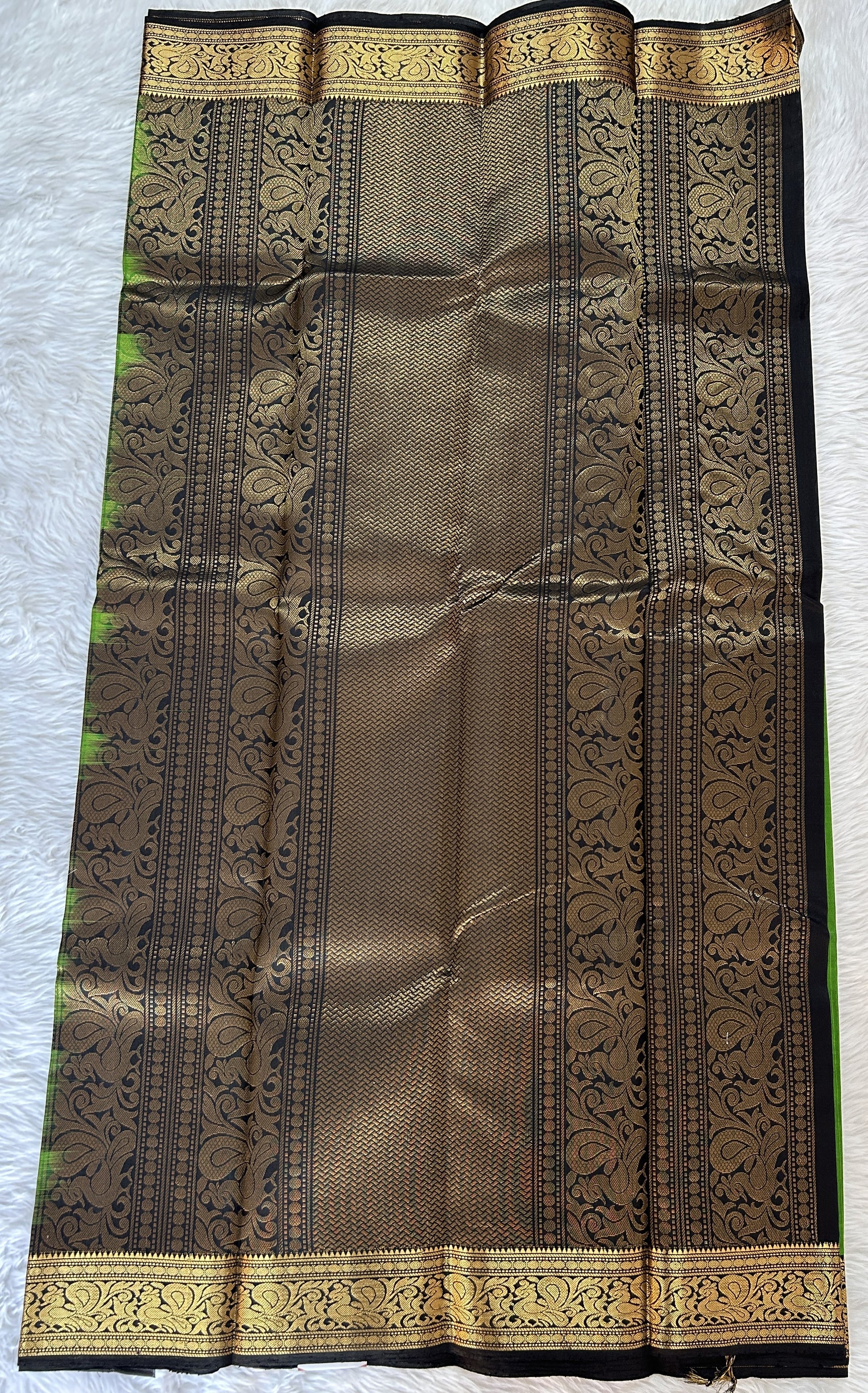 Kanjivaram Festive Silk Saree Parrot Green colored Saree complemented with a Black Color Kanchi Border. - Sampradaya Designer Studio