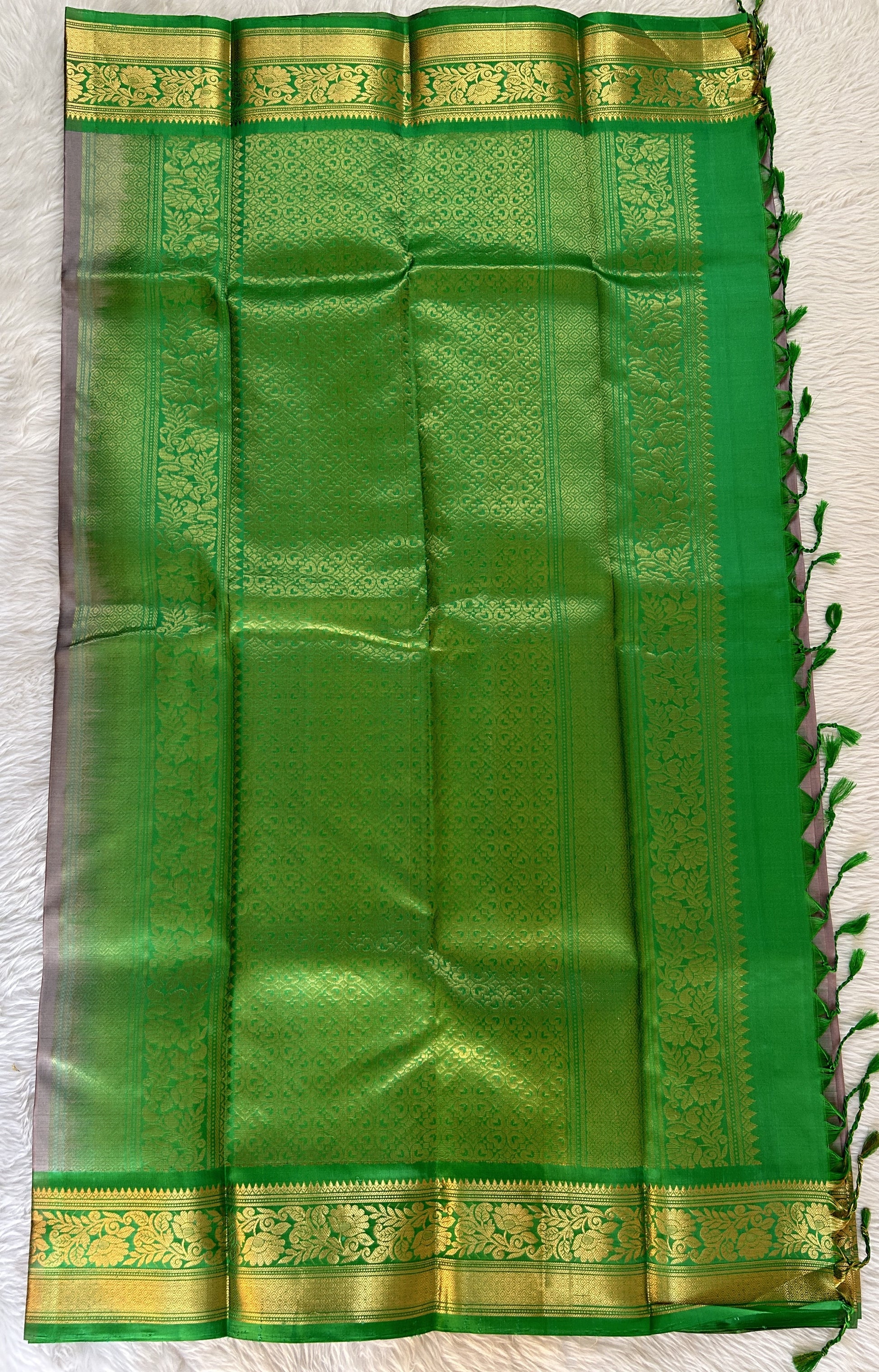 Kanjivaram Festive Silk Saree Gray colored Saree complemented with a Green Color Kanchi Border. - Sampradaya Designer Studio