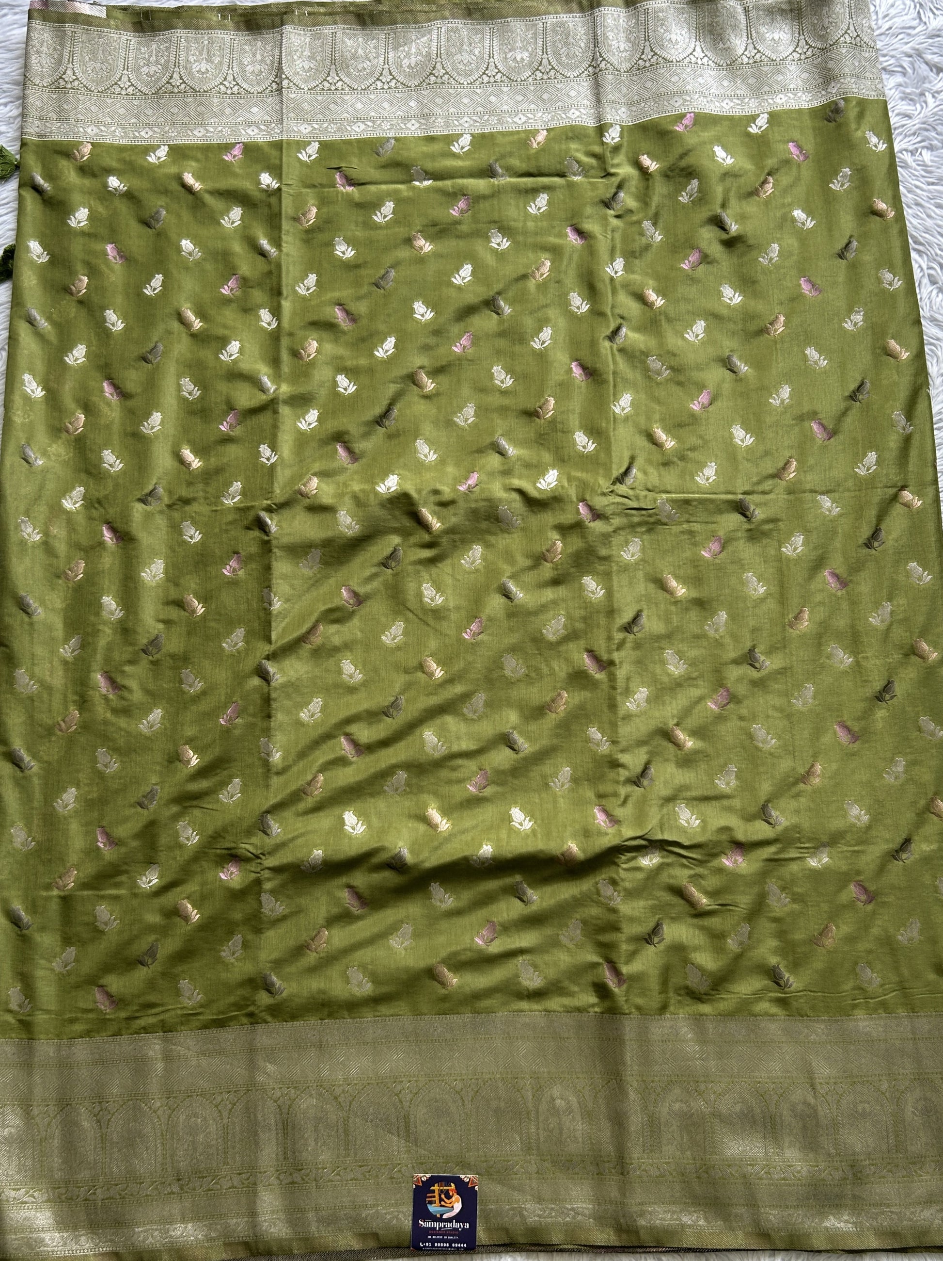 Semi Georgette Saree Olive Green Colored Complemented with a Zari Border. - Sampradaya Designer Studio