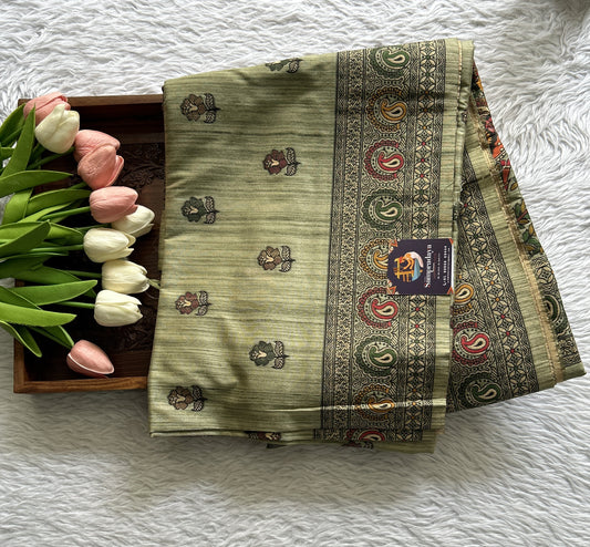 Semi Tussar Saree Green Colored complemented with a Zari Border. - Sampradaya Designer Studio