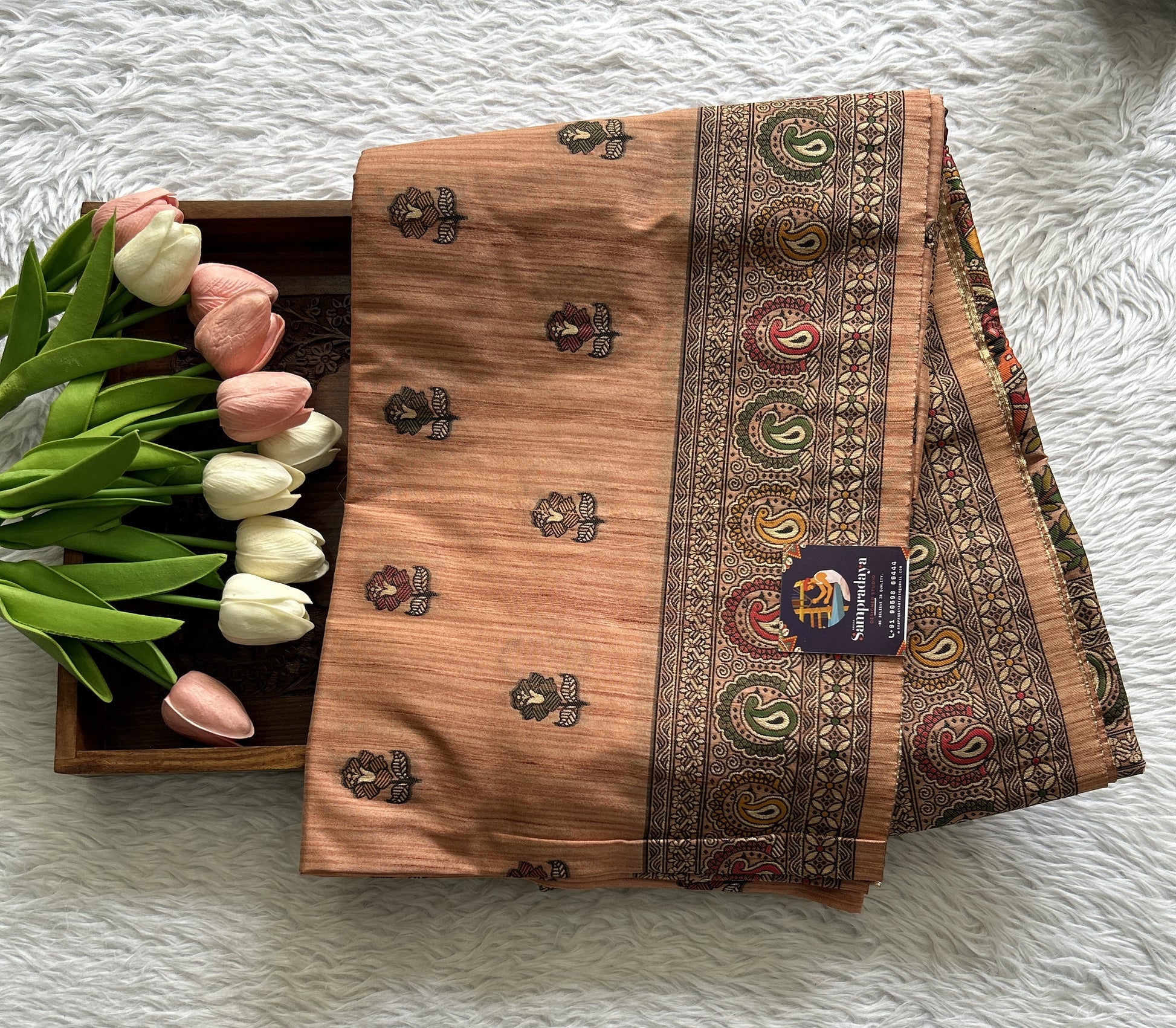 Semi Tussar Saree Peach Colored complemented with a Zari Border. - Sampradaya Designer Studio