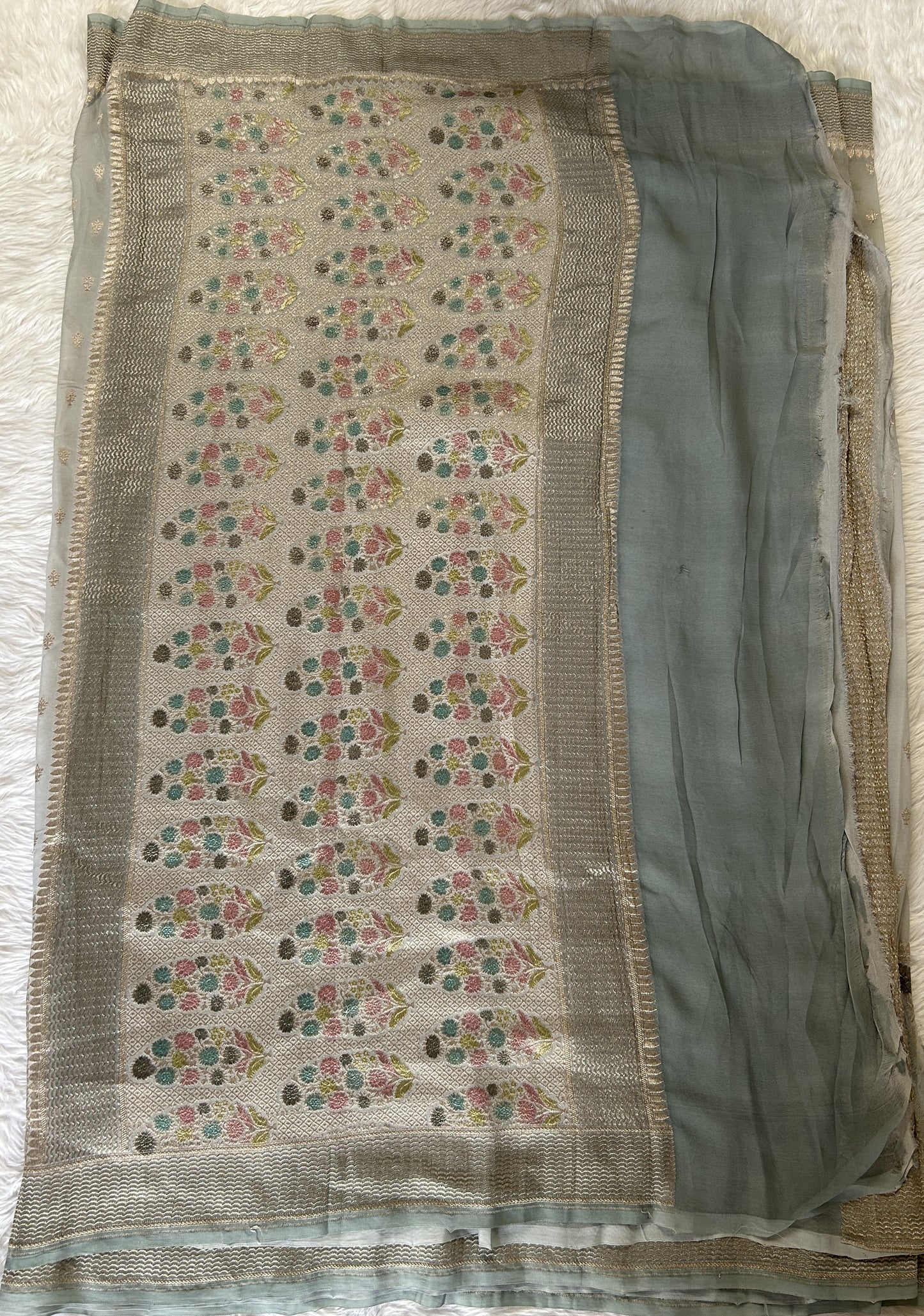 Banarasi Georgette Silk Saree Ash Green colored Saree complemented with a Silver Zari border. - Sampradaya Designer Studio