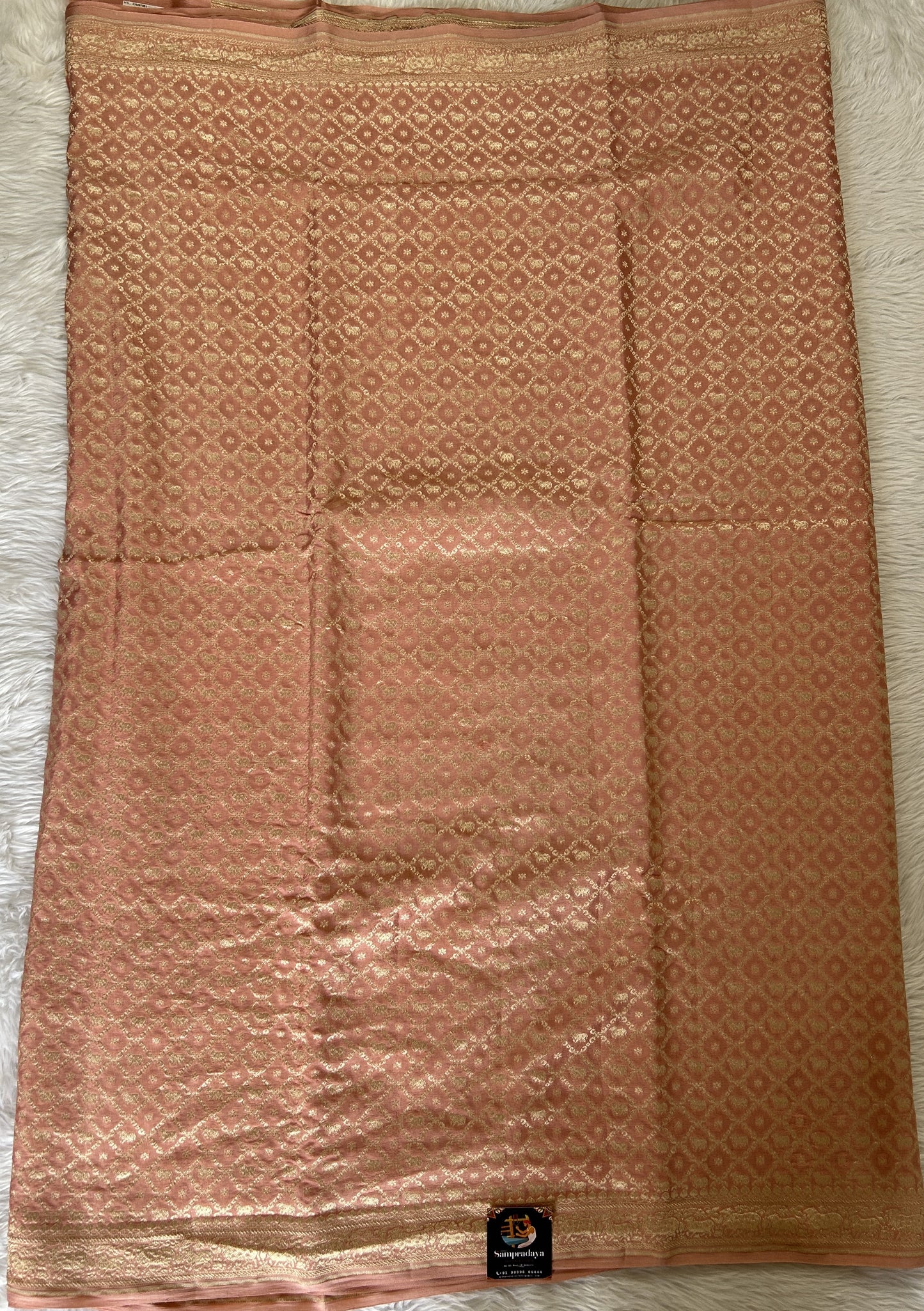 Banarasi Georgette Silk Saree Peach colored Saree complemented with a Light Gold Zari border. - Sampradaya Designer Studio