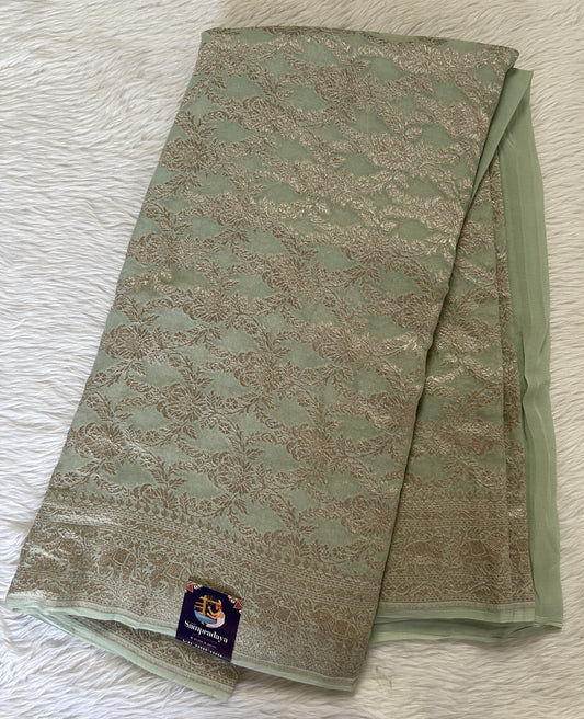 Banarasi Georgette Silk Saree Pastel Green colored Saree complemented with a Silver Zari border. - Sampradaya Designer Studio