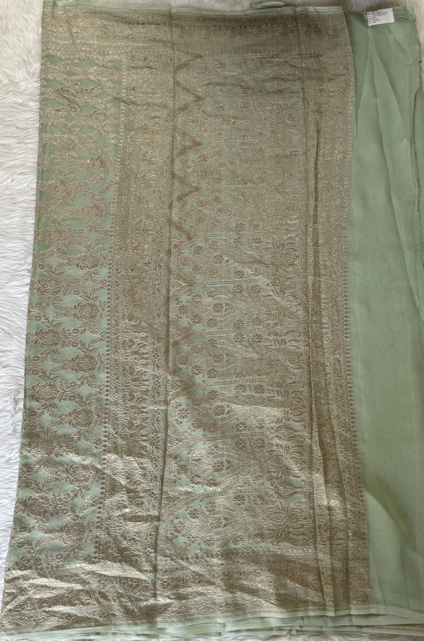 Banarasi Georgette Silk Saree Pastel Green colored Saree complemented with a Silver Zari border. - Sampradaya Designer Studio