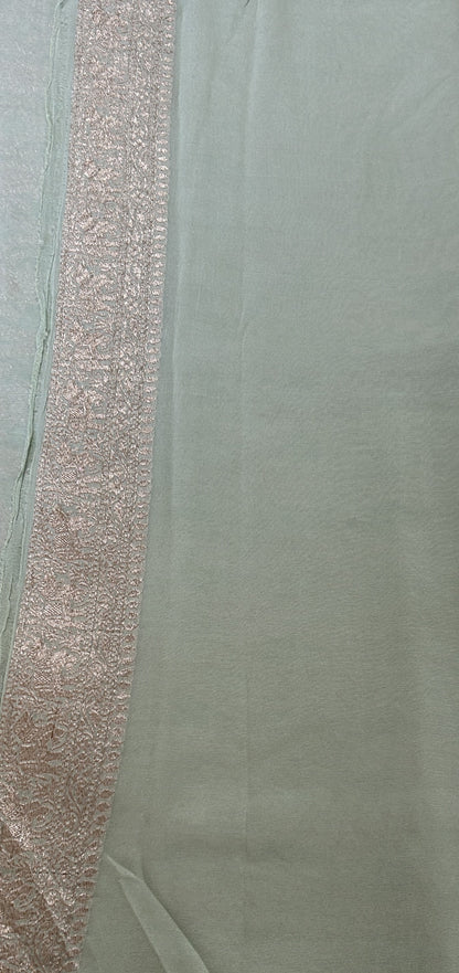 Banarasi Georgette Silk Saree Pastel Green colored Saree complemented with a Silver Zari border. - Sampradaya Designer Studio