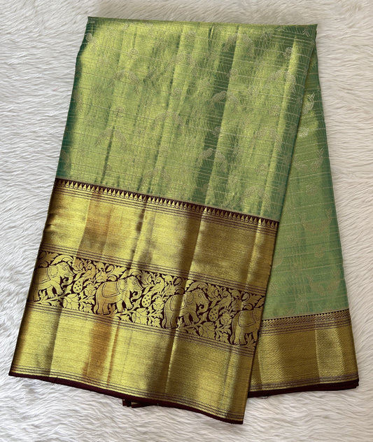 Kanjivaram Bridal Silk Saree Pastel Green colored Saree complemented with a Brown Colored Kanchi border. - Sampradaya Designer Studio