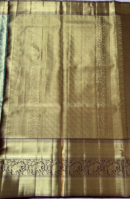 Kanjivaram Bridal Silk Saree Pastel Green colored Saree complemented with a Brown Colored Kanchi border. - Sampradaya Designer Studio