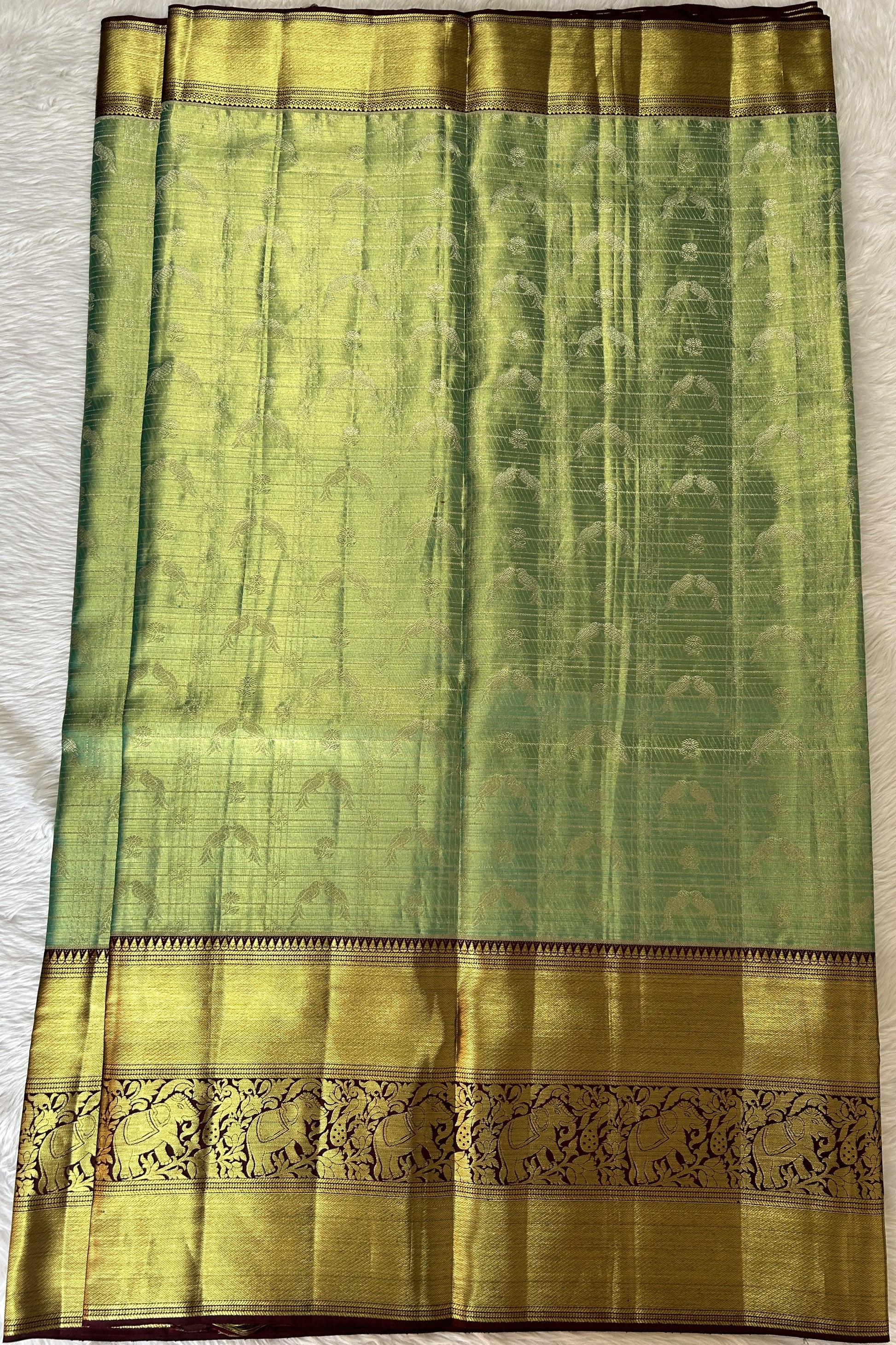 Kanjivaram Bridal Silk Saree Pastel Green colored Saree complemented with a Brown Colored Kanchi border. - Sampradaya Designer Studio