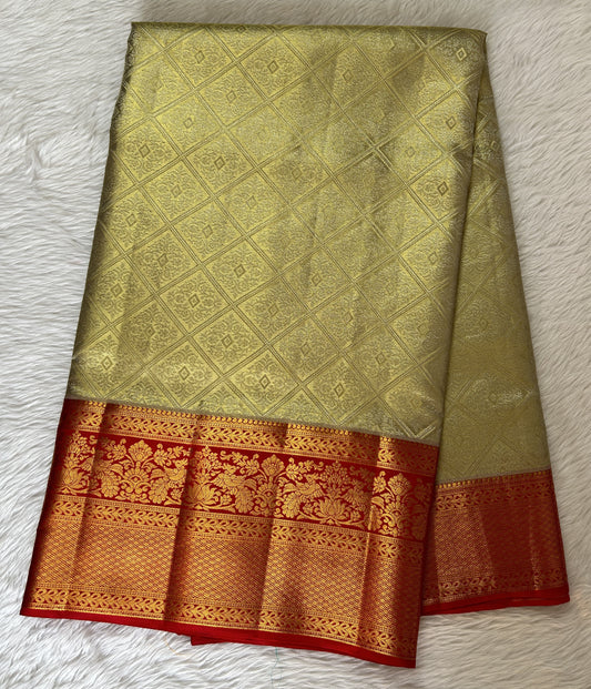 Kanjivaram Bridal Silk Saree Cream colored Saree complemented with a Red Colored Kanchi border. - Sampradaya Designer Studio