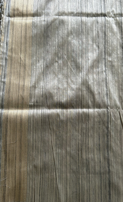 Semi Tussar Saree Gray Colored complemented with a Zari Border. - Sampradaya Designer Studio