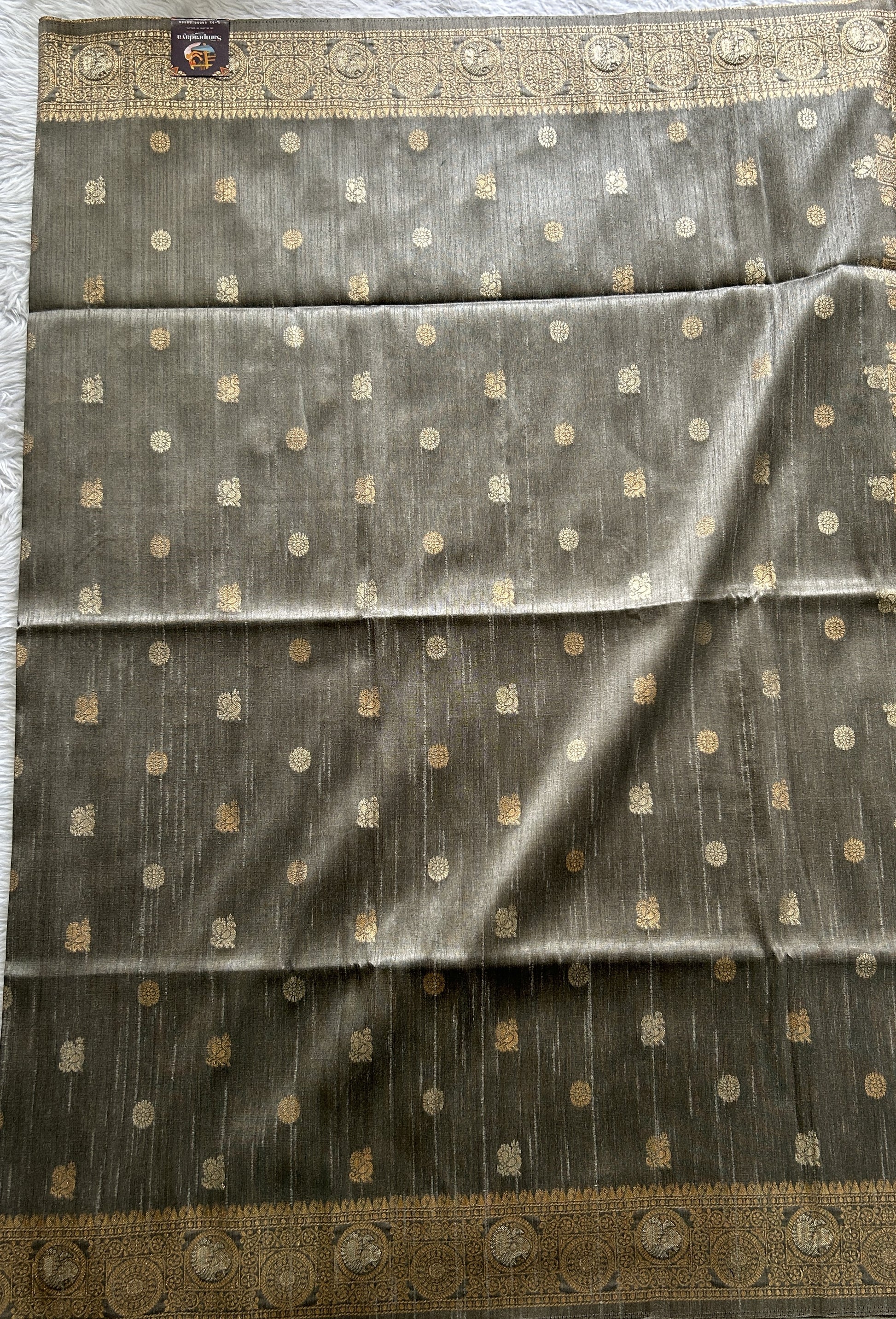 Semi Tussar Saree Gray Colored complemented with a Zari Border. - Sampradaya Designer Studio