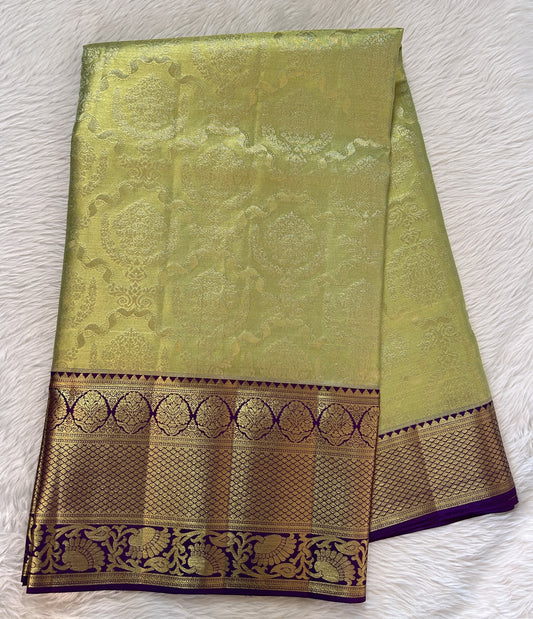 Kanjivaram Bridal Silk Saree Parrot Green colored Saree complemented with a Purple Colored Gold Kanchi border. - Sampradaya Designer Studio