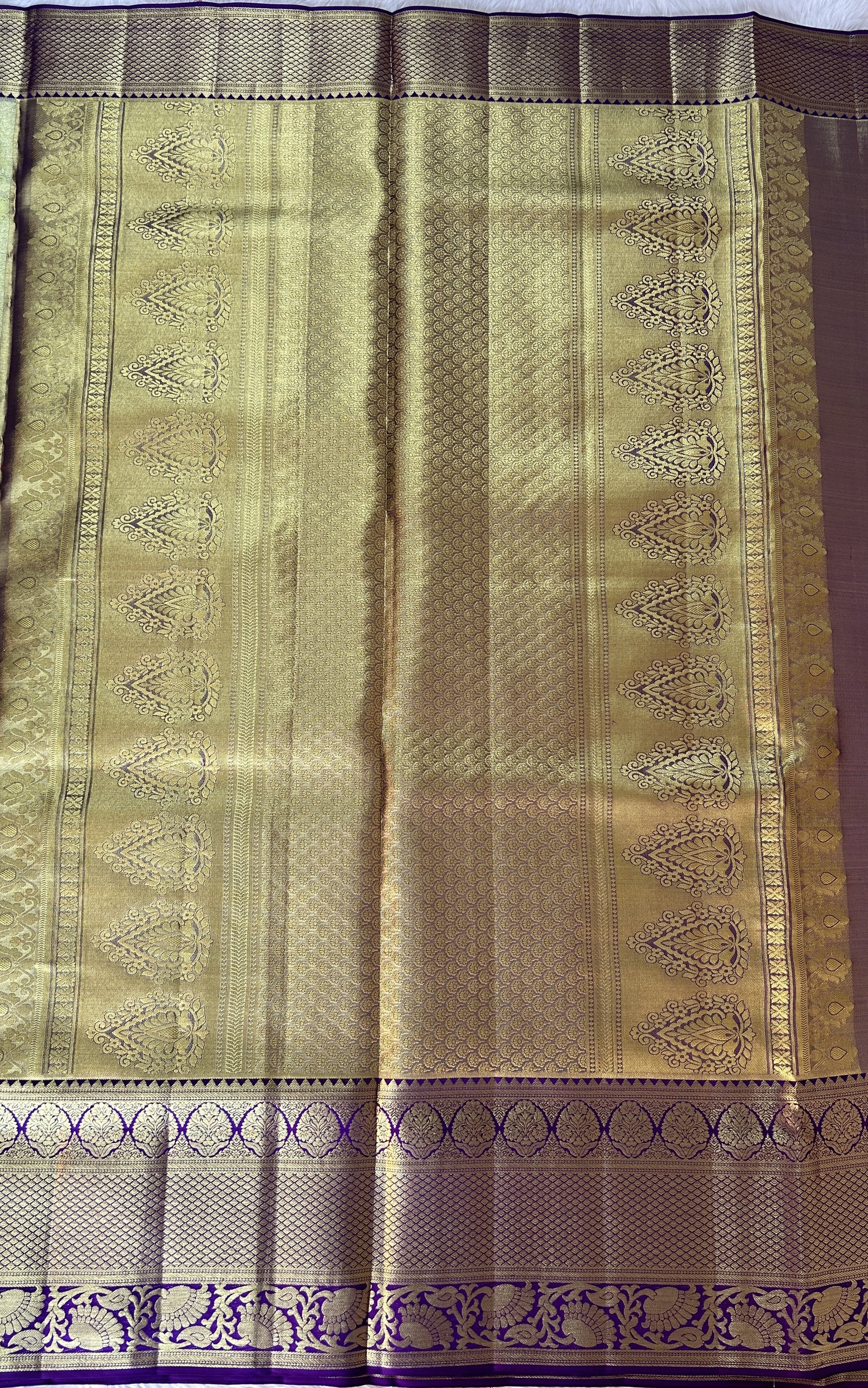 Kanjivaram Bridal Silk Saree Parrot Green colored Saree complemented with a Purple Colored Gold Kanchi border. - Sampradaya Designer Studio