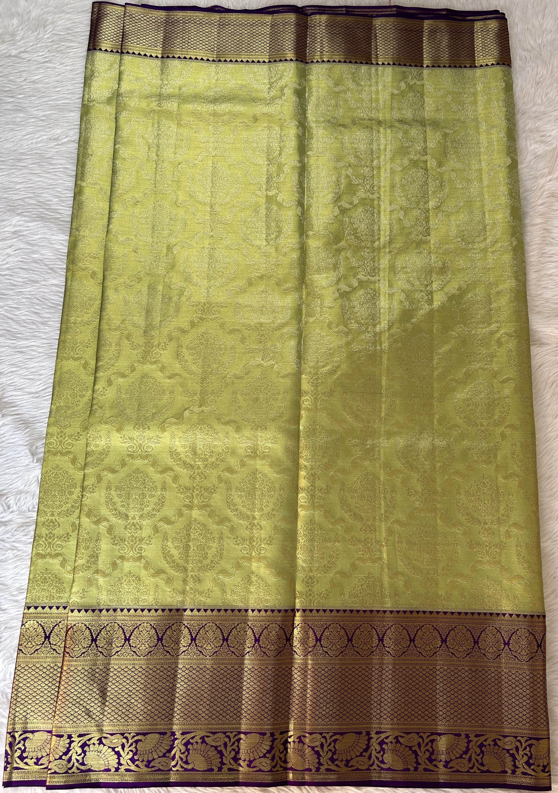 Kanjivaram Bridal Silk Saree Parrot Green colored Saree complemented with a Purple Colored Gold Kanchi border. - Sampradaya Designer Studio