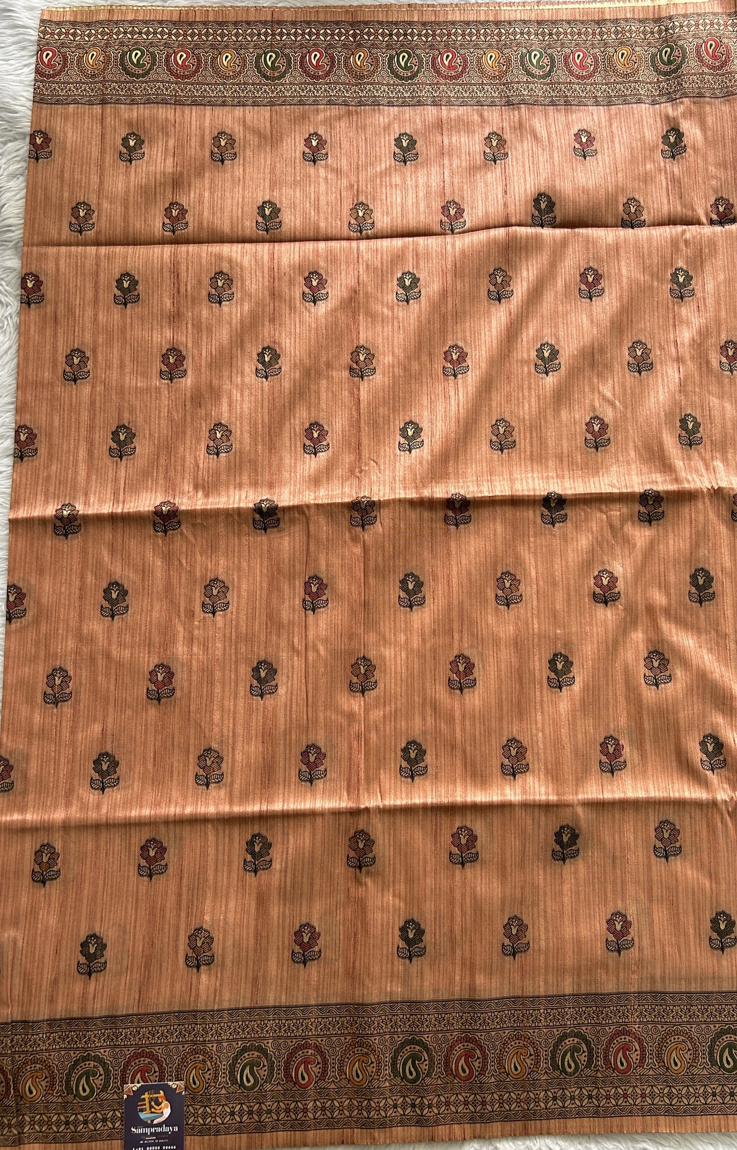 Semi Tussar Saree Peach Colored complemented with a Zari Border. - Sampradaya Designer Studio