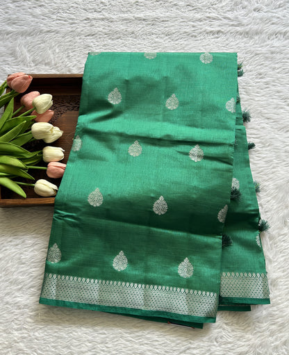 Semi Tussar Saree Bottle Green Colored complemented with a Zari Border. - Sampradaya Designer Studio