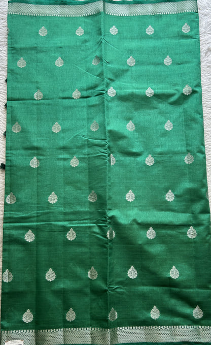 Semi Tussar Saree Bottle Green Colored complemented with a Zari Border. - Sampradaya Designer Studio