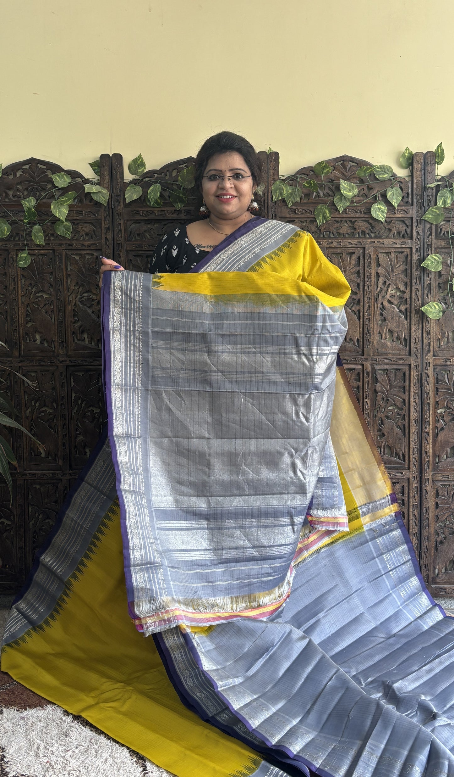 Gadwal Silk Saree Yellow Colored Complemented With a Gray Zari Border