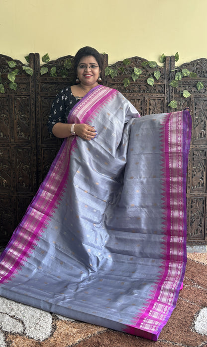 Gadwal Silk Saree Gray Colored Complemented With a Pink Zari Border