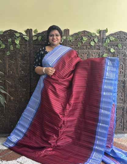 Gadwal Silk Saree Maroon Colored Complemented With a Gray Zari Border