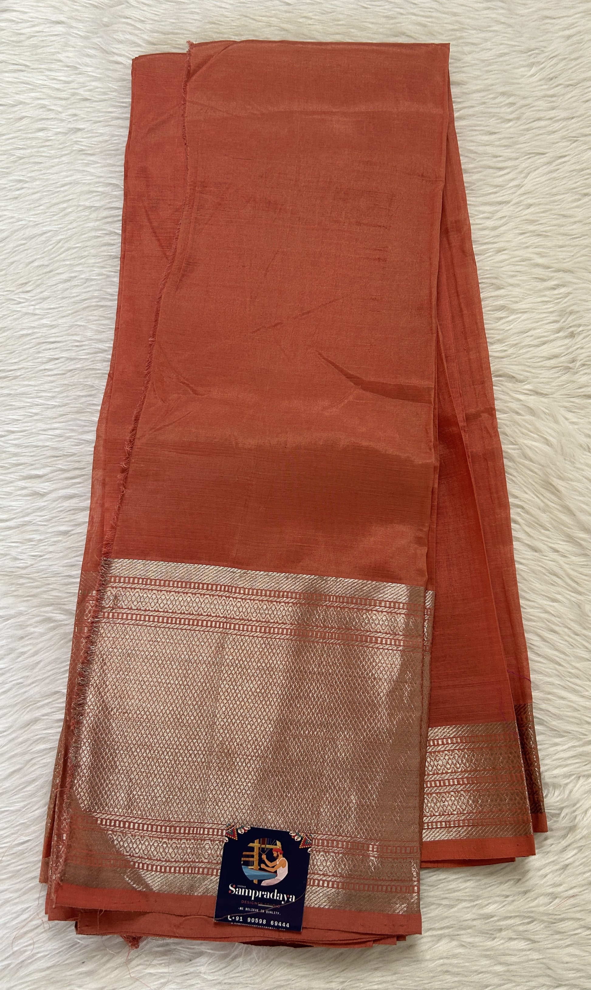 Mangalagiri Plain Pattu Saree Coral colored Saree complemented with a Gold Mangalagiri  Border - Sampradaya Designer Studio