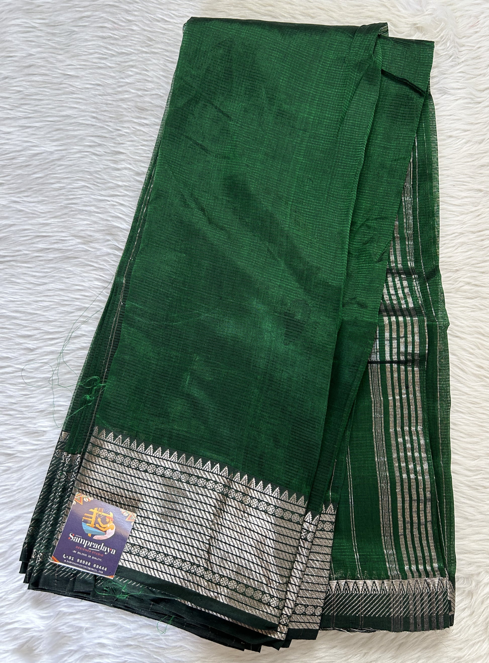 Mangalagiri Plain Pattu Saree Bottle Green colored Saree complemented with a Silver Mangalagiri Border - Sampradaya Designer Studio