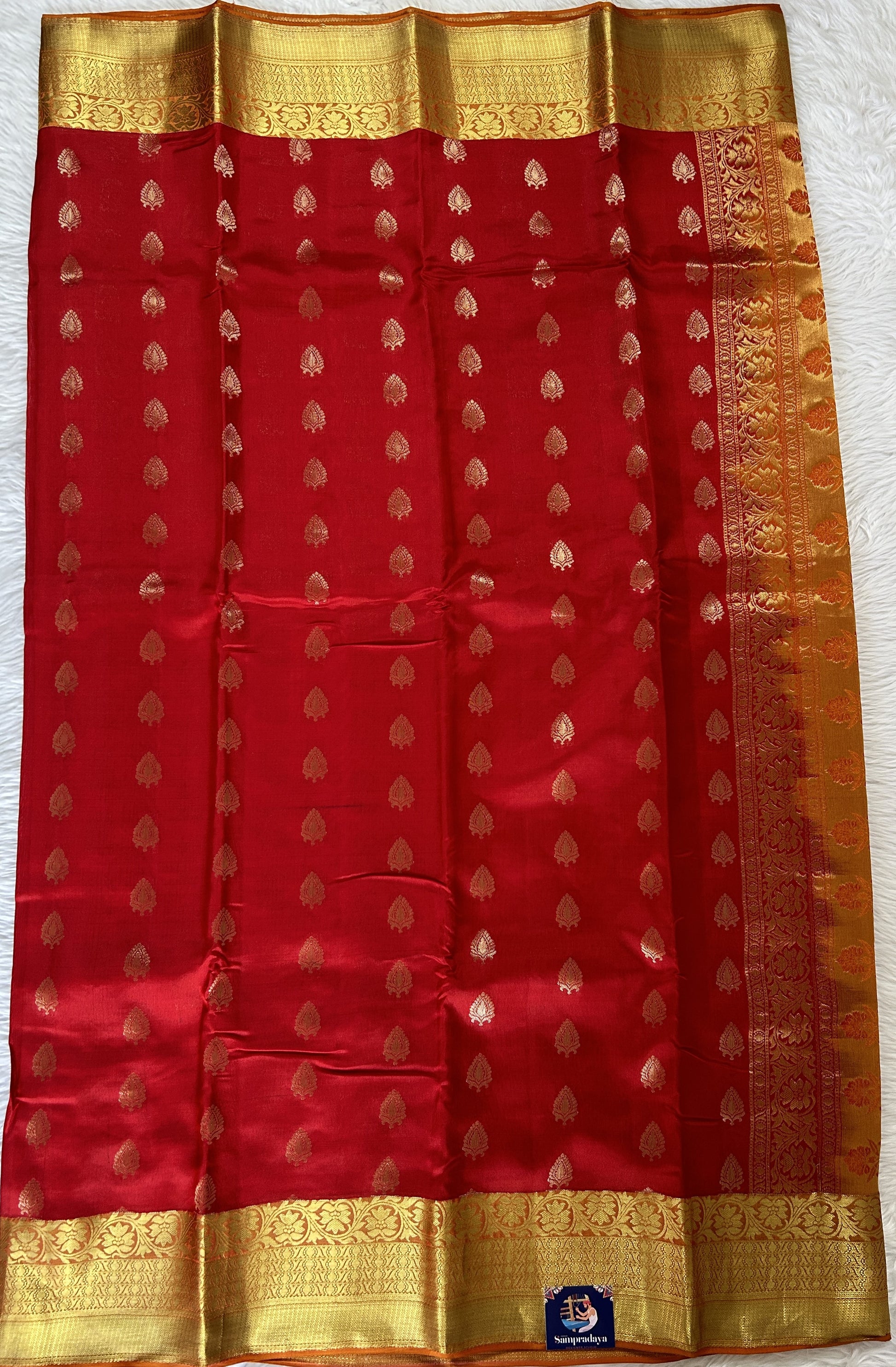 Kanjivaram Powerloom Silk Saree Red colored Saree complemented with a Orange Colored Gold Kanchi border. - Sampradaya Designer Studio