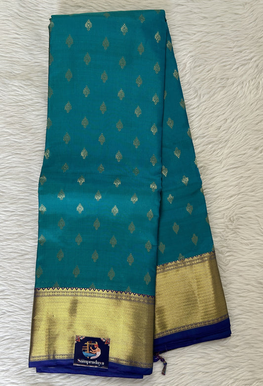 Kanjivaram Powerloom Silk Saree Turquoise Blue colored Saree complemented with a Royal Blue Colored Gold Kanchi border. - Sampradaya Designer Studio