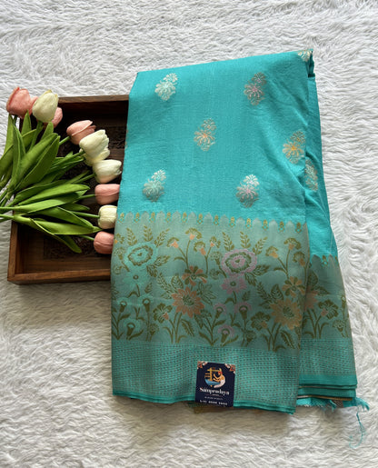 Semi Georgette Saree Sky Blue Colored Complemented with a Zari Border. - Sampradaya Designer Studio