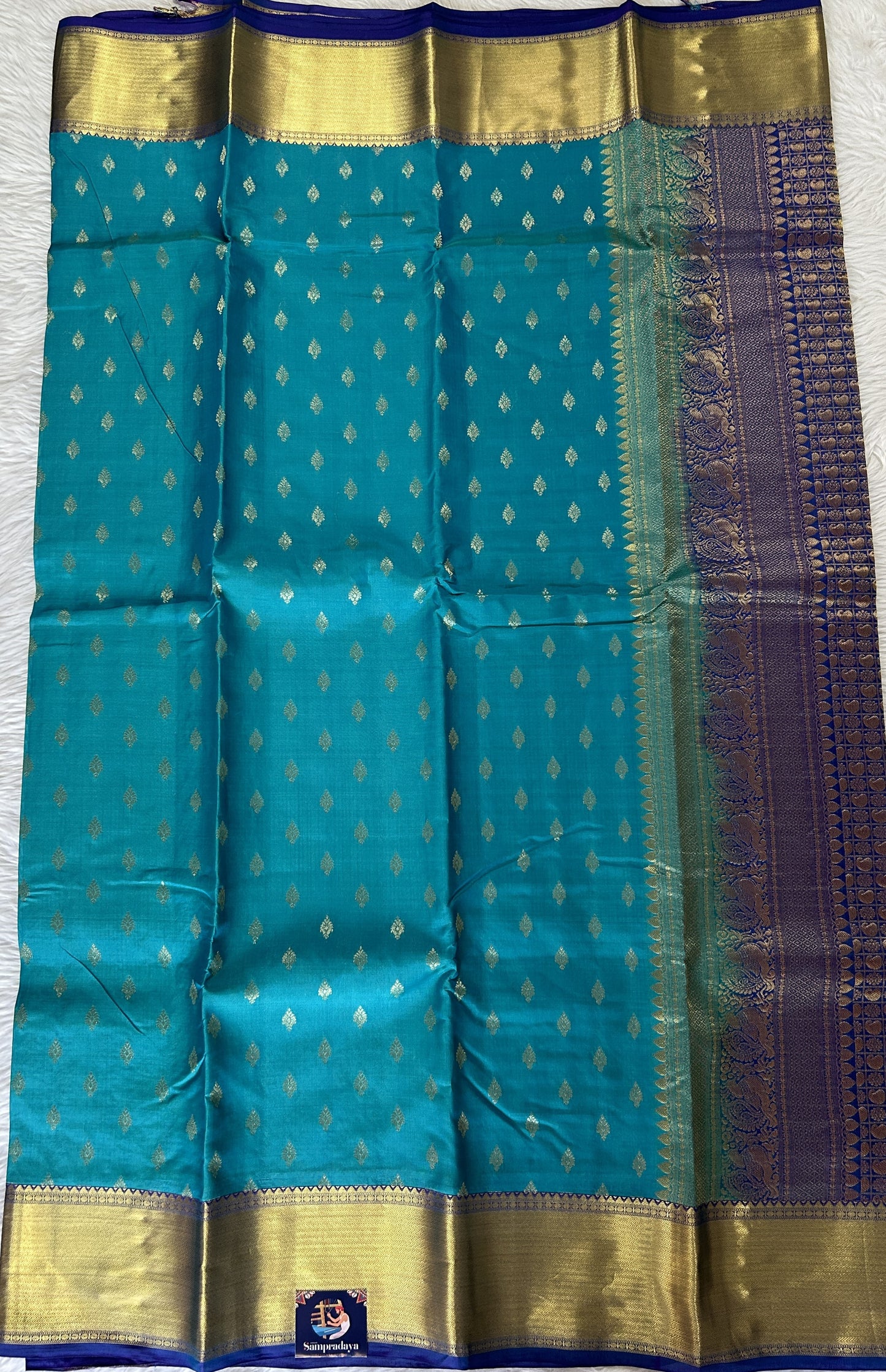 Kanjivaram Powerloom Silk Saree Turquoise Blue colored Saree complemented with a Royal Blue Colored Gold Kanchi border. - Sampradaya Designer Studio