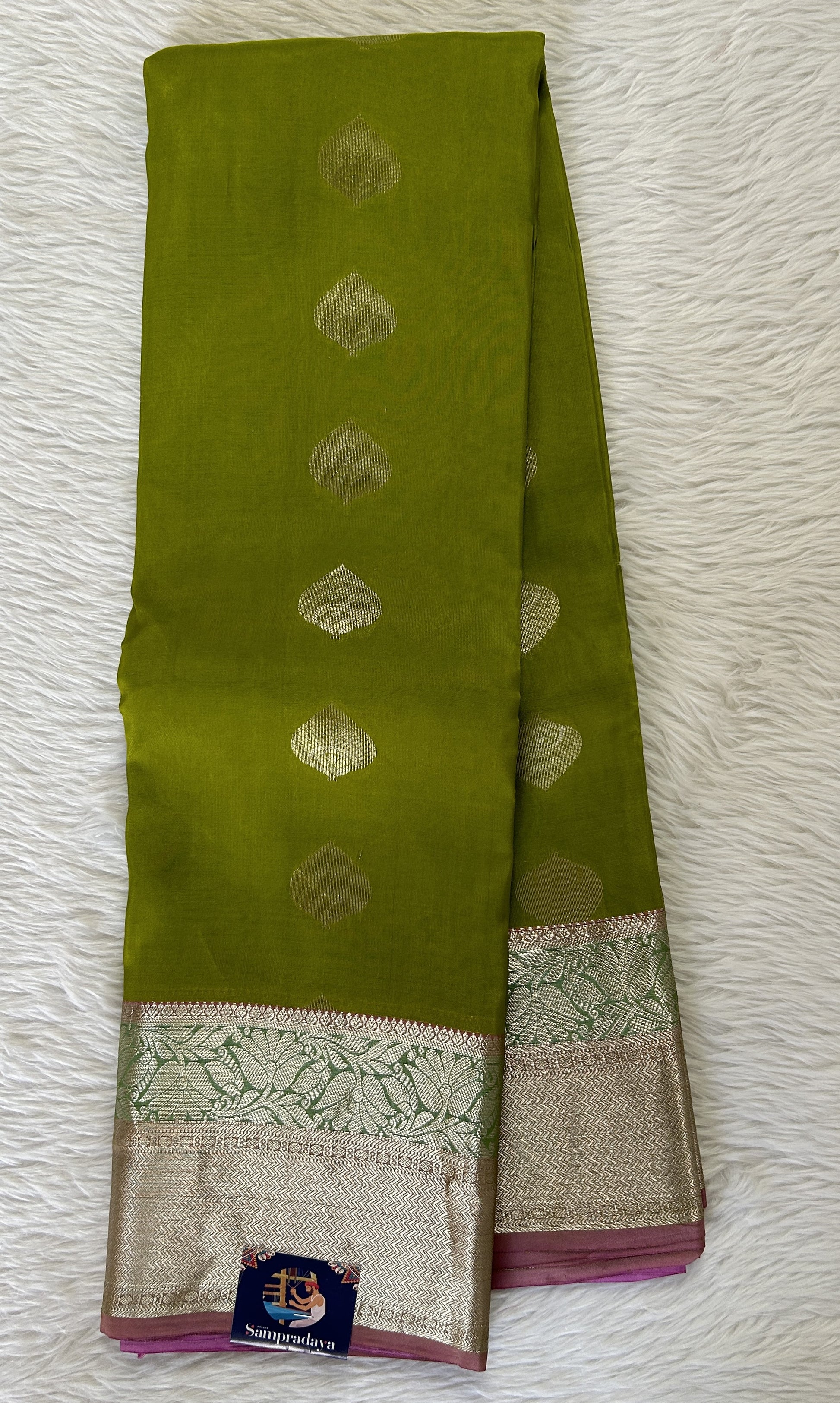 Kanjivaram Powerloom Silk Saree Parrot Green colored Saree complemented with a Baby Pink Colored Silver Kanchi border. - Sampradaya Designer Studio