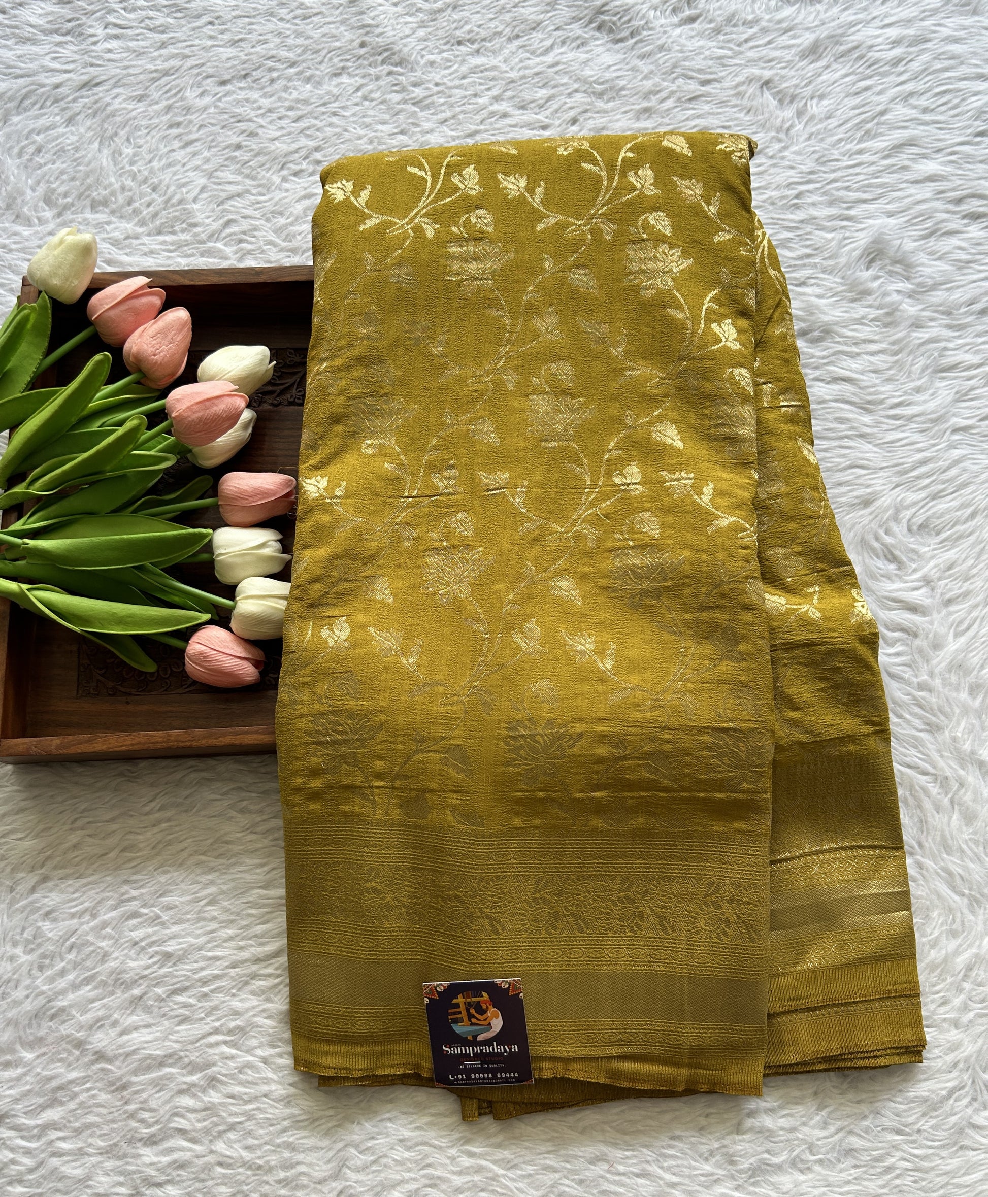 Semi Georgette Saree Olive Green Colored Complemented with a Zari Border. - Sampradaya Designer Studio