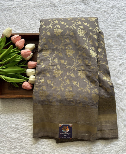 Semi Georgette Saree Ash Colored Complemented with a Zari Border. - Sampradaya Designer Studio