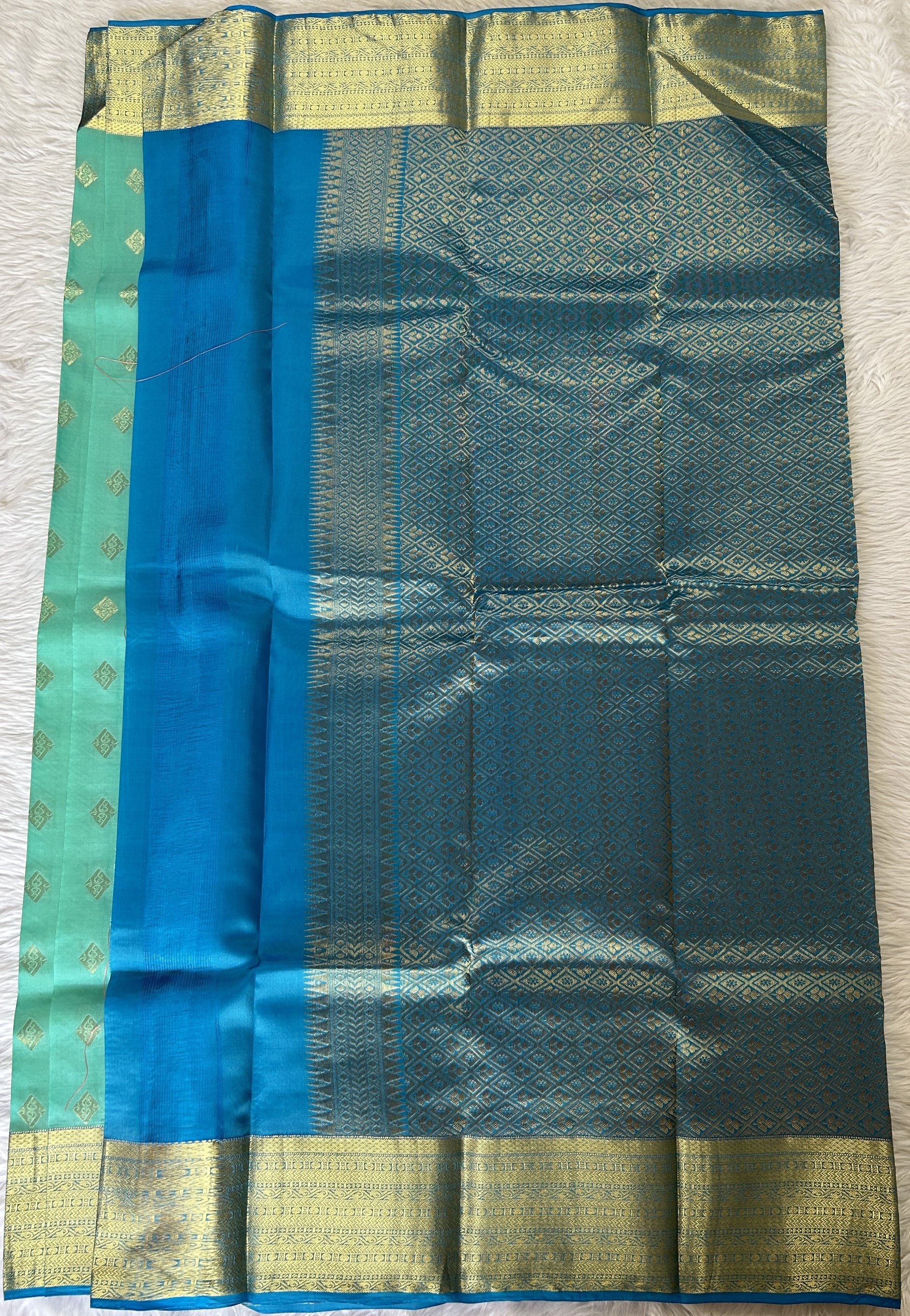 Kanjivaram Powerloom Silk Saree Aqua Blue colored Saree complemented with a Dark Blue Colored Gold Kanchi border. - Sampradaya Designer Studio