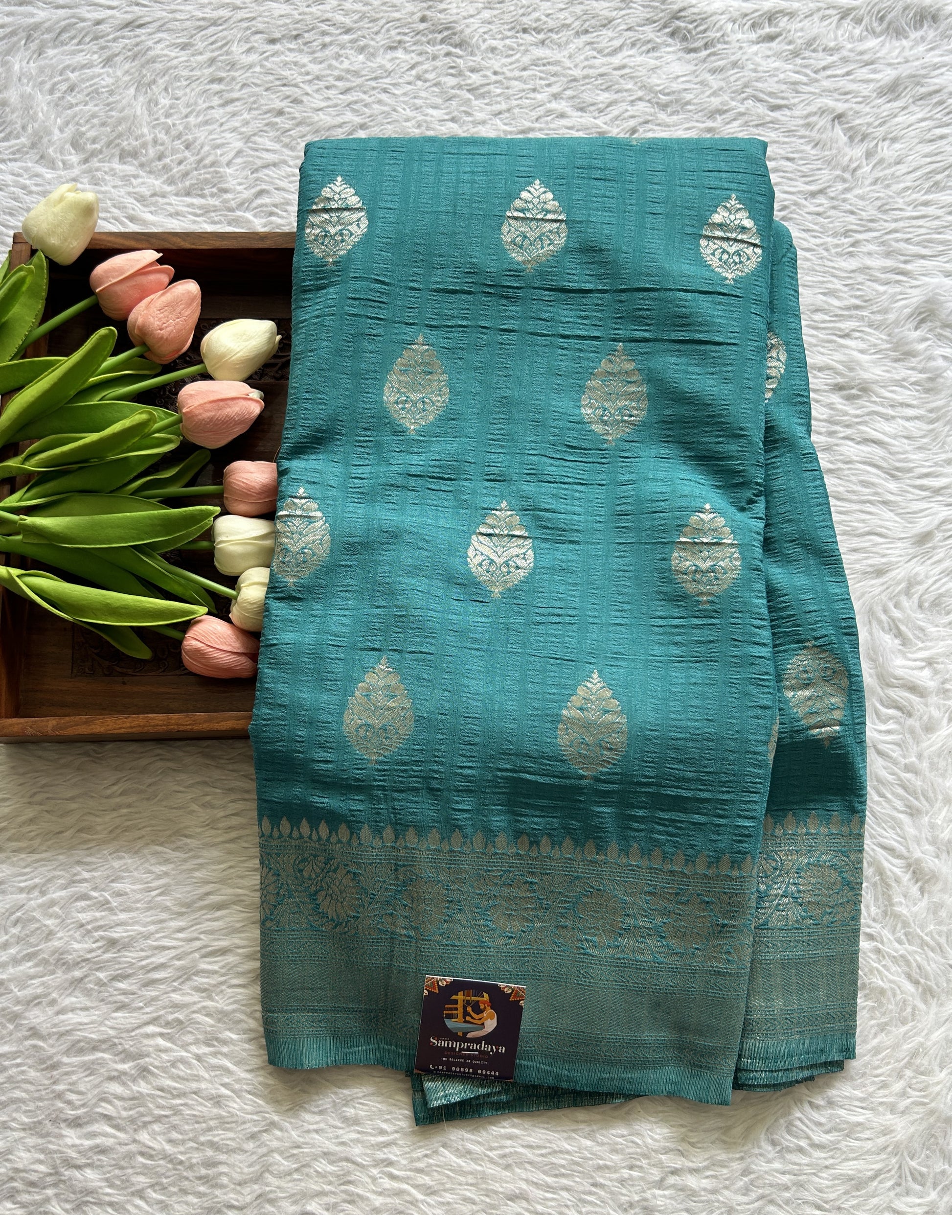 Semi Georgette Saree Teal Blue Colored Complemented with a Zari Border. - Sampradaya Designer Studio