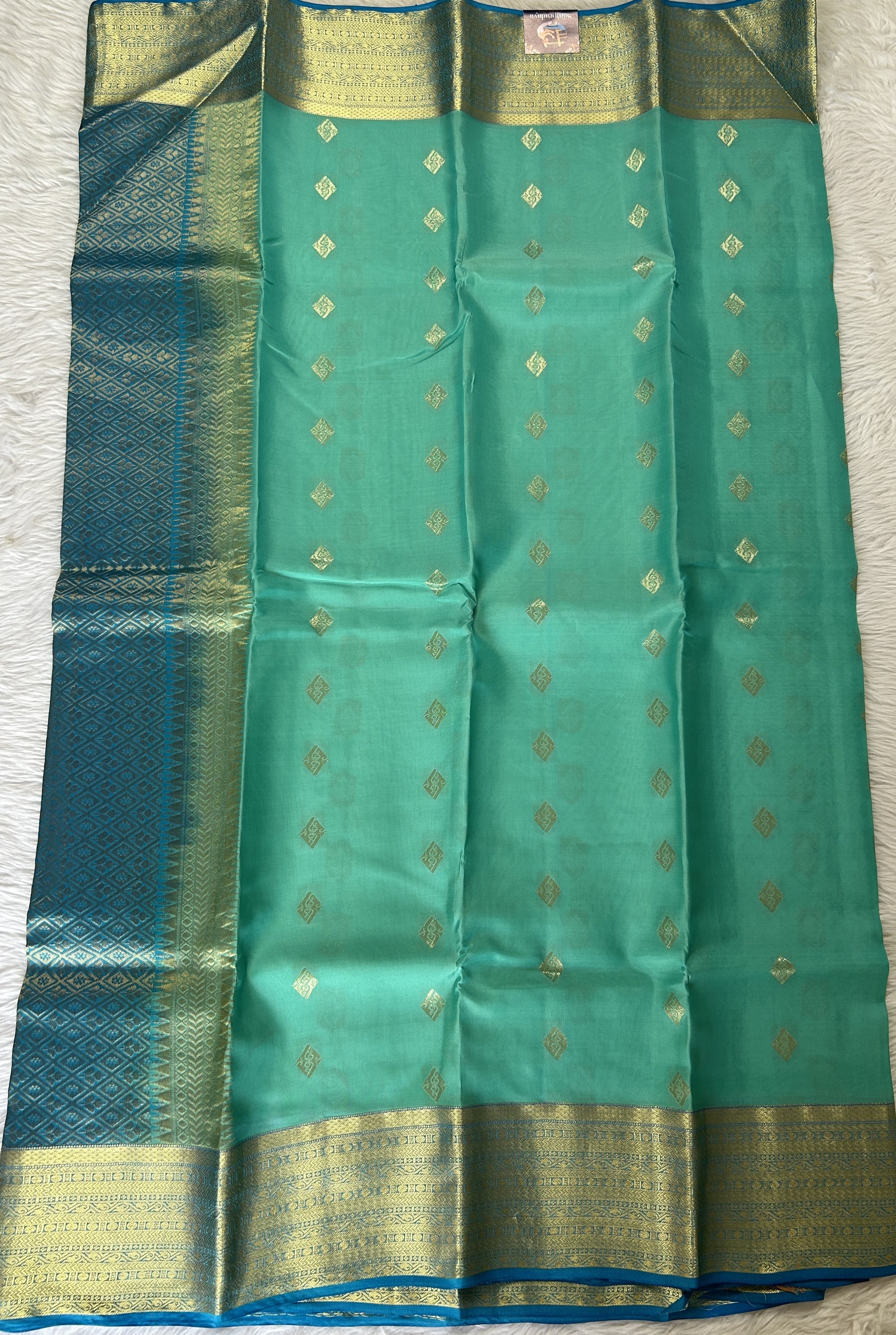 Kanjivaram Powerloom Silk Saree Aqua Blue colored Saree complemented with a Dark Blue Colored Gold Kanchi border. - Sampradaya Designer Studio