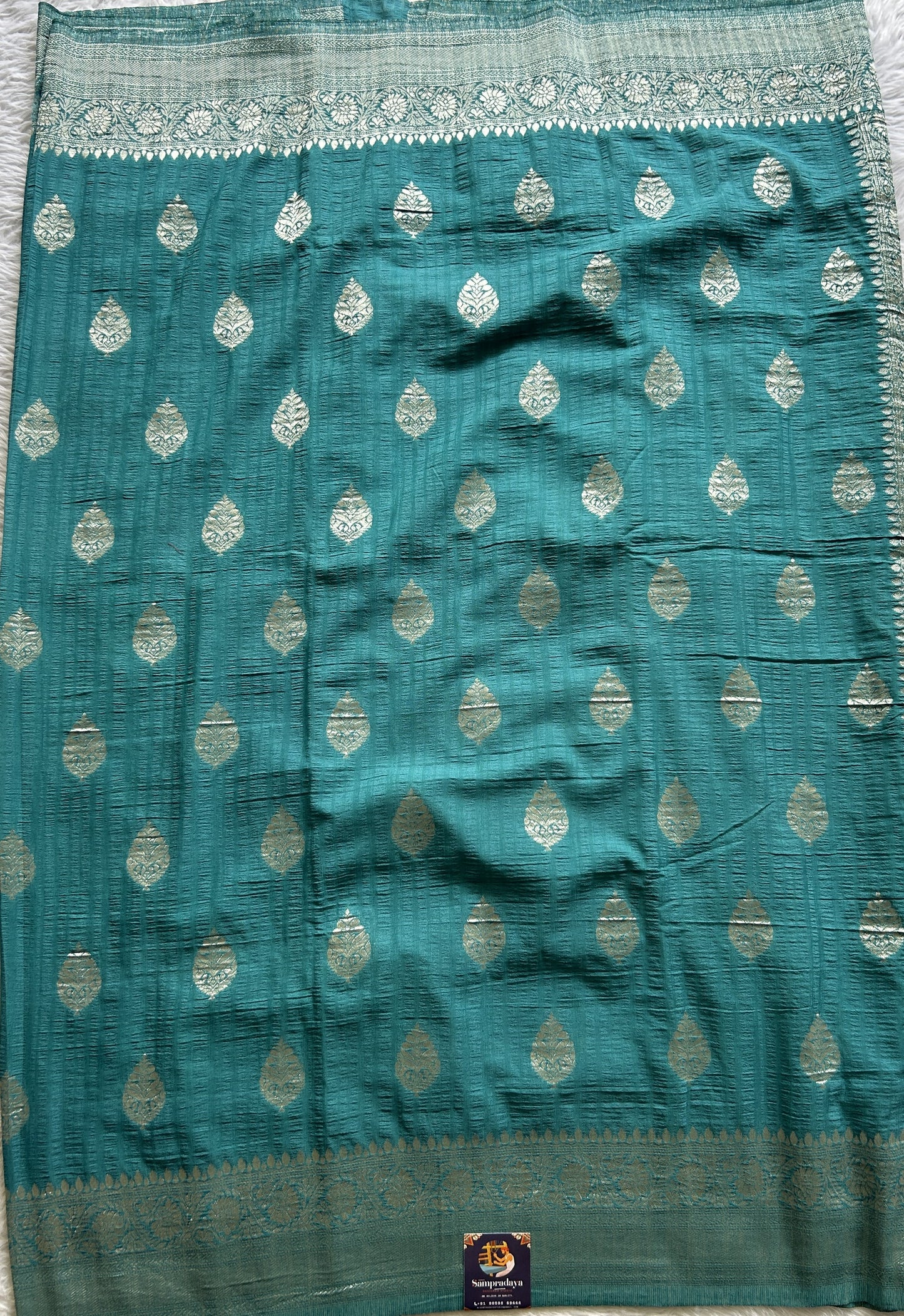 Semi Georgette Saree Teal Blue Colored Complemented with a Zari Border. - Sampradaya Designer Studio